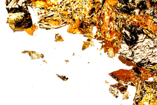 istock Gold Leaf Pieces Close Up on A White Background as Decorative Pieces 1855185160