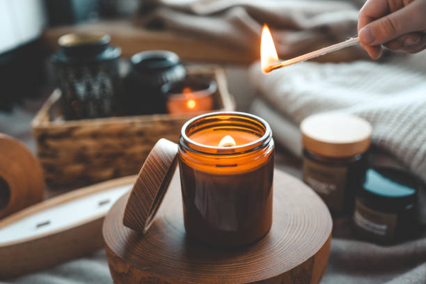 istock Match in hand lighting candles, aesthetics 1855196694
