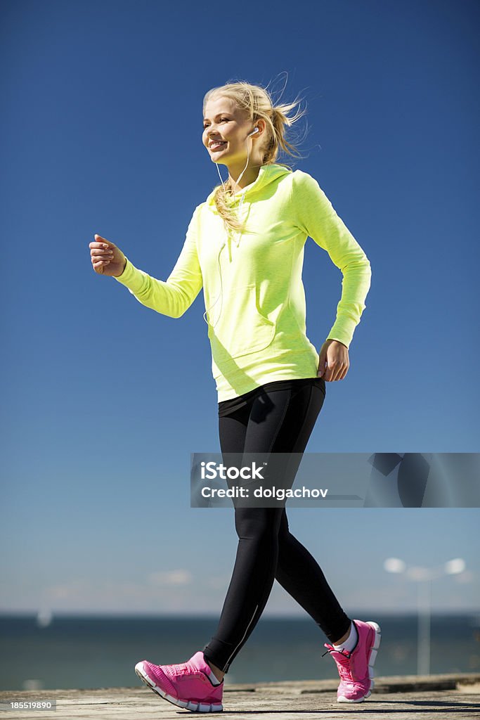 woman doing sports outdoors fitness and lifestyle concept - woman doing sports outdoors Activity Stock Photo