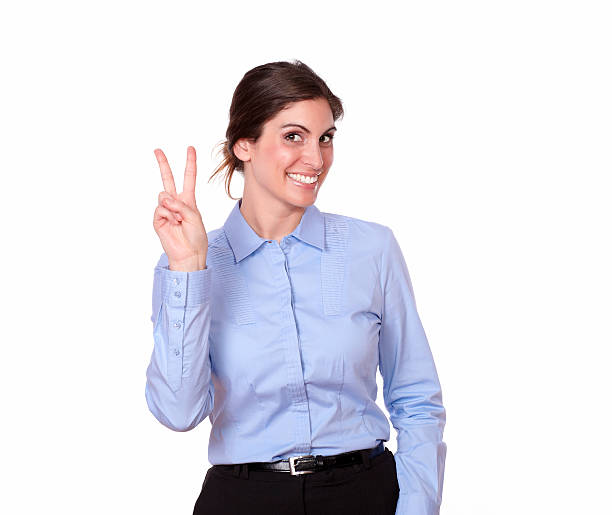 istock Attractive woman smiling with victory sign 185519990