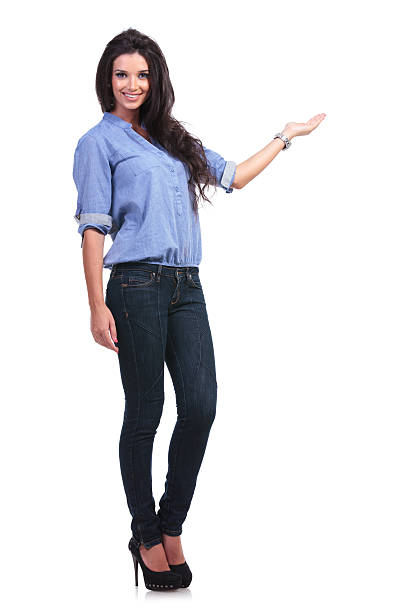 istock casual woman presents with smile 185521327