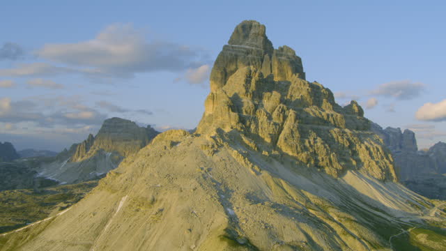Golden hour sunset on Tre Cime Mountain Peaks in Italy Dolomite Alps