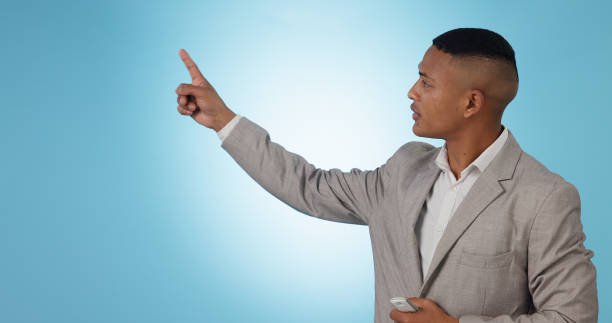 istock Weather forecast, pointing or man talking with hands for mockup space on blue background. Reporter, anchor or presenter in broadcast for presentation, climate change prediction or news in studio 1855241242