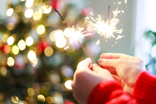 istock Young woman holding sparkler 1855247580
