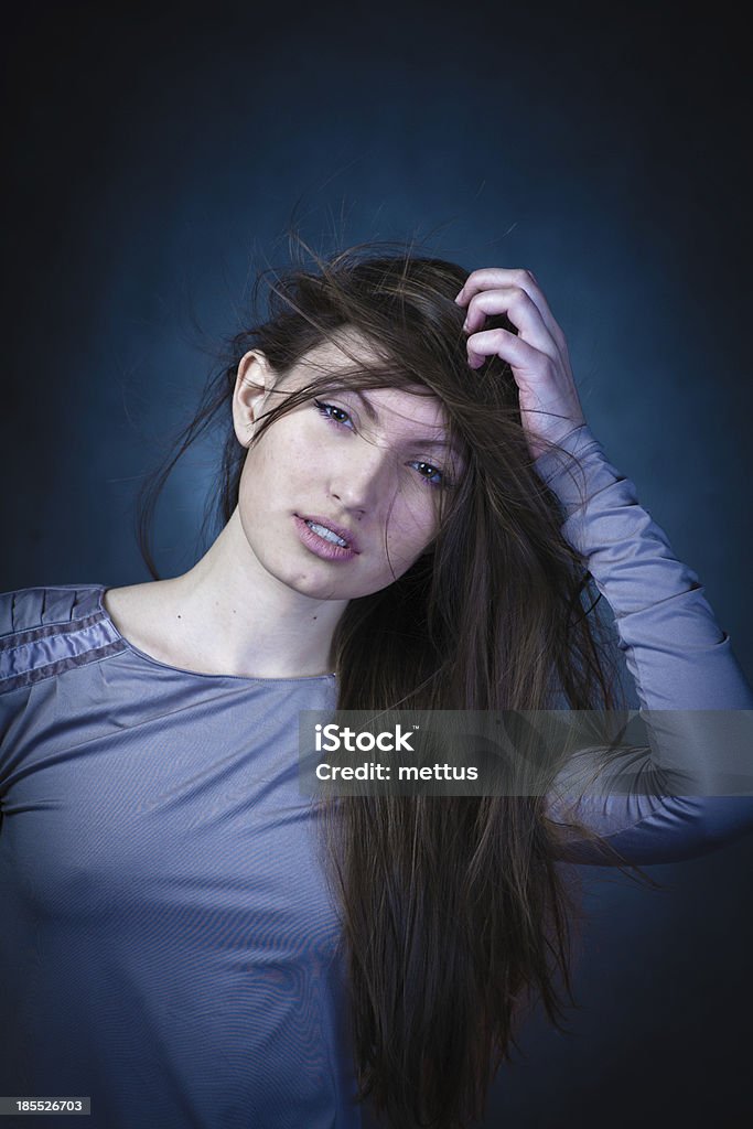 studio portrait of woman studio portrait of woman with long hair 20-24 Years Stock Photo