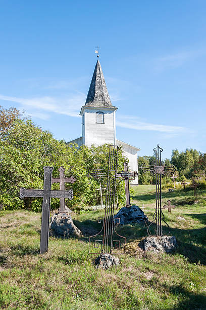 istock Graveyard crosses and white church 185526875