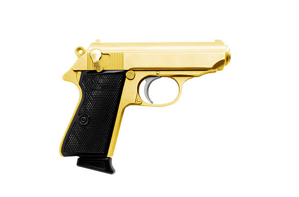 istock Golden revolver gun isolated on white 185526928