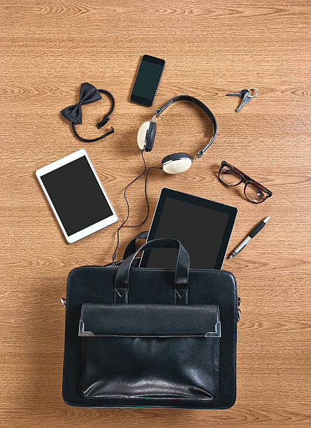 istock Business accessories of a modern briefcase scattered on desk 185527024
