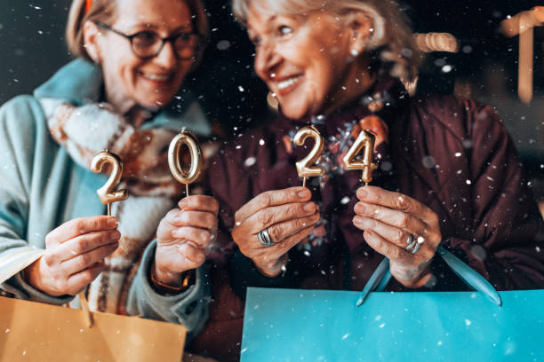 istock Two beautiful senior women celebrates Christmas's. 1855271614