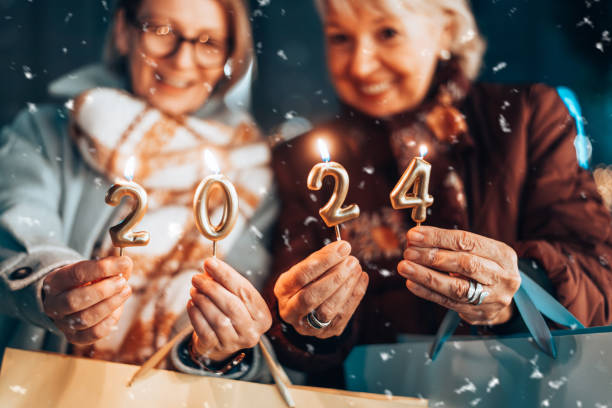 istock Two beautiful senior women celebrates Christmas's. 1855273380