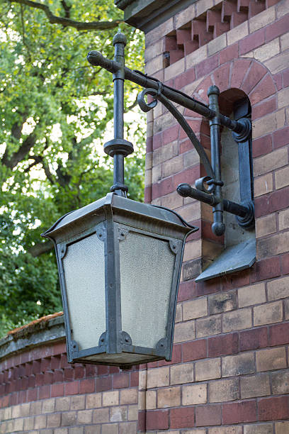 istock Metal lantern on a brick wall with glass 185527341