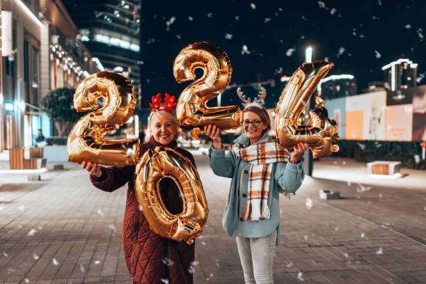 istock Two beautiful senior women celebrates Christmas's. 1855273749