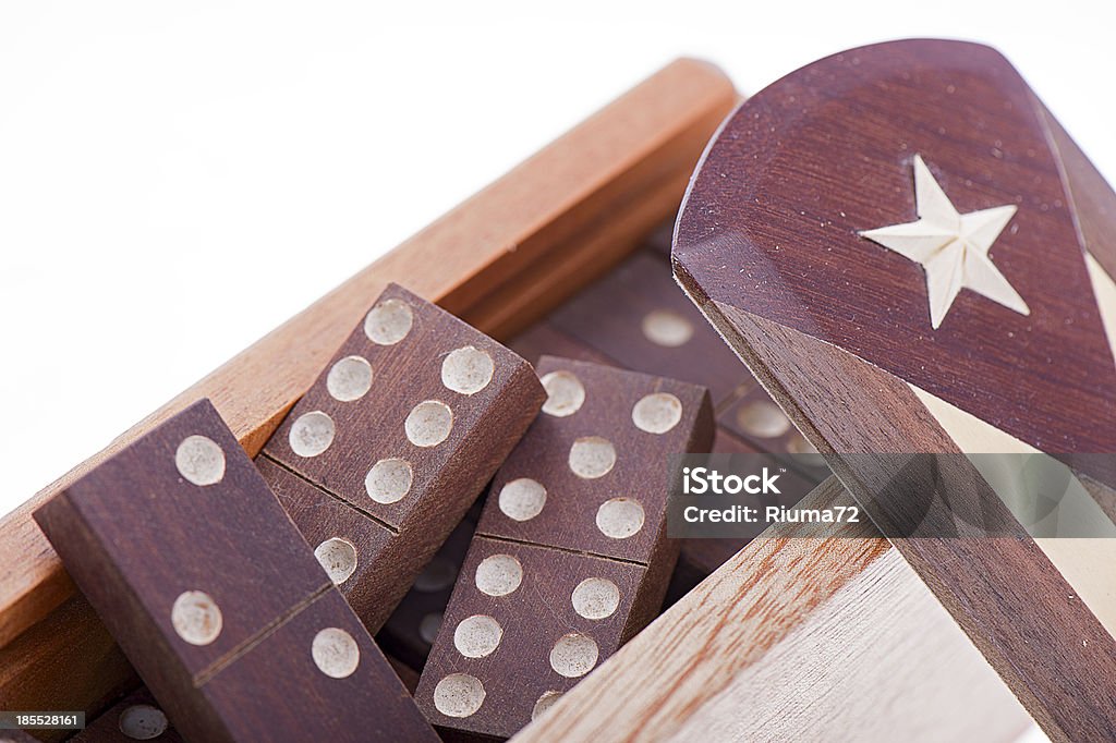 Domino in wooden box with Cuba's flag on white background Domino in wooden box with Cuba's flag against the white background Activity Stock Photo