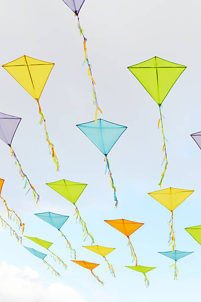istock Kites in the clouds against a blue sky 185528321
