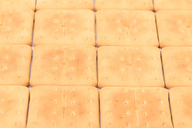 istock Background of saltine soda crackers. 185528703