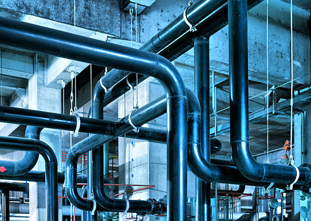 Industrial Zone pipeline Equipment, cables and piping as found inside of industrial power plant pipe smoking pipe stock pictures, royalty-free photos & images