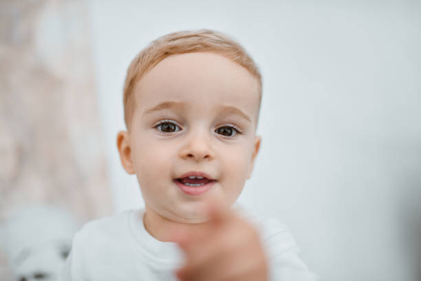istock Smiling Male Toddler Pointing With Finger 1855302953