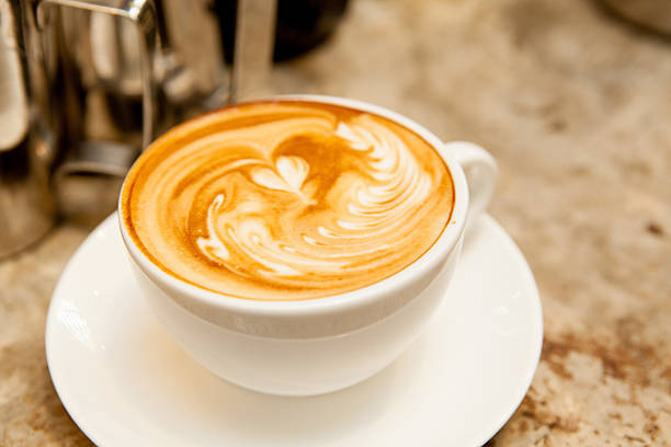 istock Latte art, coffee on the wooden desk as background. 185532497