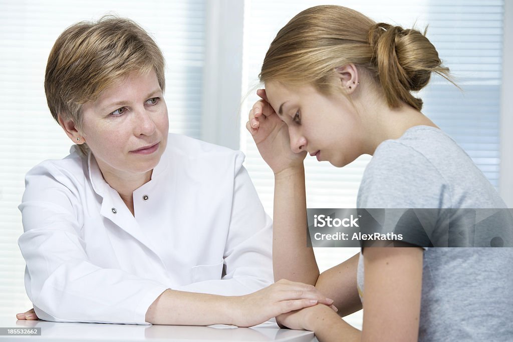 conversation with a therapist teenage girl suffering with depression in a conversation with a therapist Adolescence Stock Photo