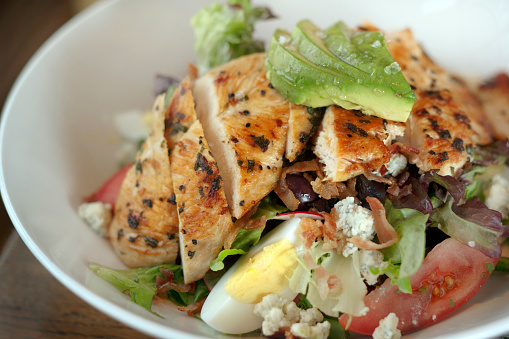 Center Street Cobb salad with chicken, egg, olives, string beans, tomato, avocado, bacon and blue cheese