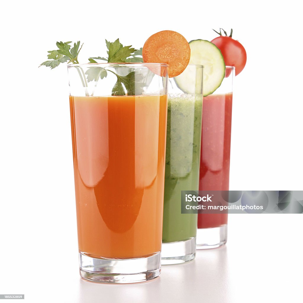 Three glasses of vegetable juice on a white background vegetable juice Juice - Drink Stock Photo