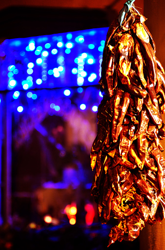 Close view of Hatch chile ristras with background light bokeh. Old town Albuquerque new mexico