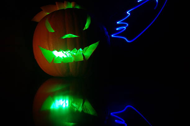 istock Green Illuminated pumpkin with light painting 185539407