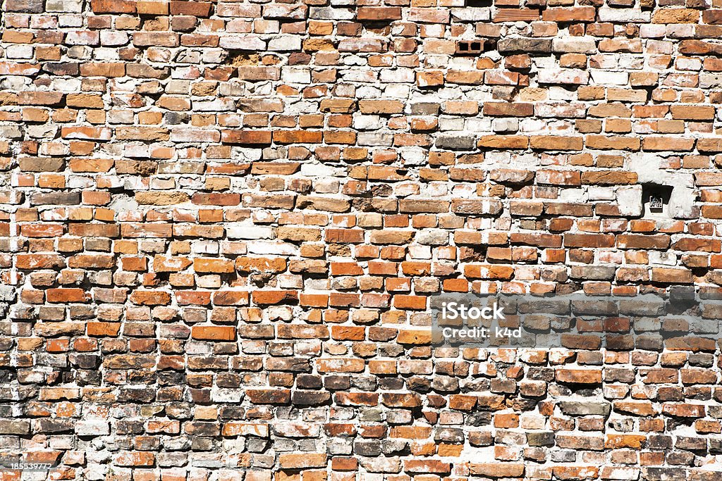 Fondo de pared de ladrillo viejo - Foto de stock de Agrietado libre de derechos