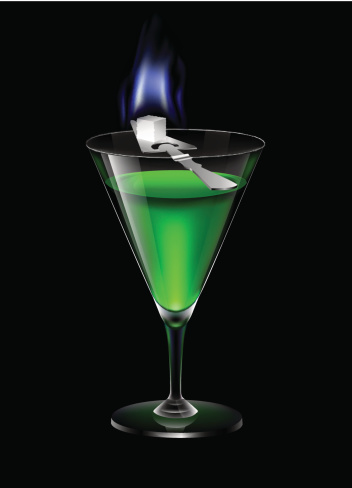 A glass of absinthe with burning sugar upon