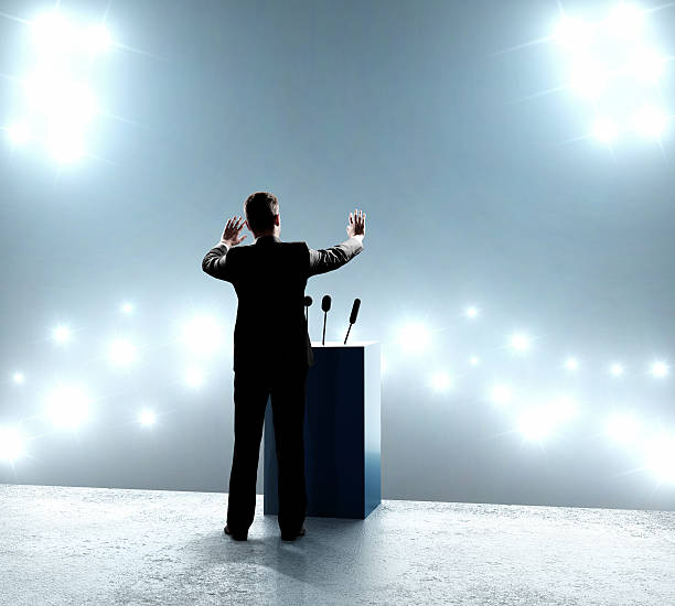 istock businessman standing on podium 185540418