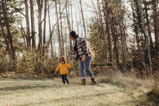 istock Toddler Girl and Mom Going for a Walk 1855406023