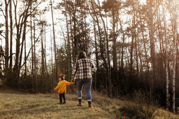 istock Toddler Girl and Mom Going for a Walk 1855414065