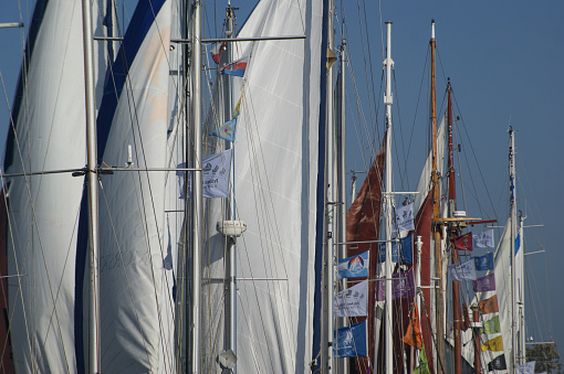 Rally of old yachts in the port of Gdynia in the old marina at the Beniowski quay. Sailing yachts being prepared for the regatta.