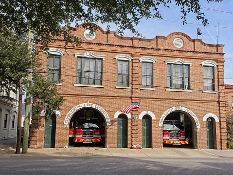 Charleston, South Carolina - USA, November 30, 2023. The Charleston Meeting street fire department and engines in station bay. Architecture and street scenes along Meeting Street in downtown historic Charleston South Carolina.