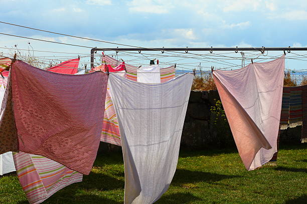 istock clothes hanging to dry on a laundry line 185542854