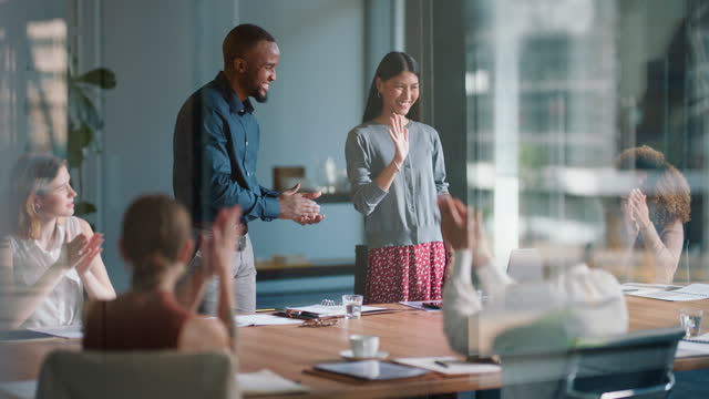 Business people, applause and handshake for contract success, b2b deal and agreement or promotion meeting. Manager and employees shaking hands for congratulations, teamwork and clapping in a window