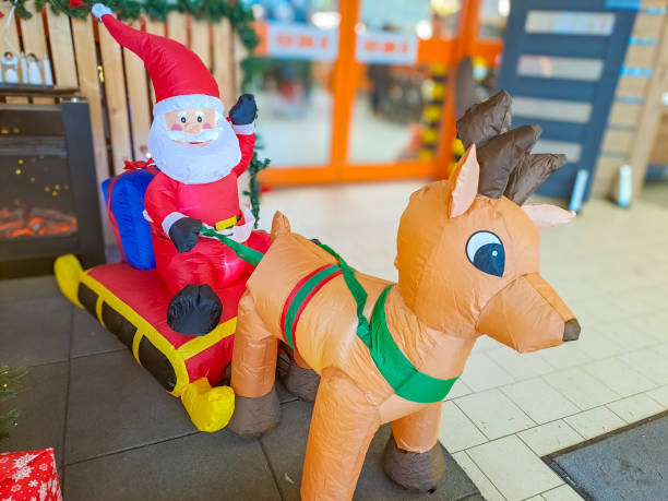istock Santa Claus rides a sleigh pulled by a deer. Christmas tree toys. Czevh 1855468984
