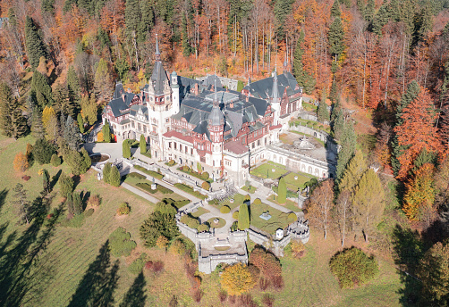 Panoramic picture of the beautiful Peles Castle and its beautiful gardens near Sinaia, Romania