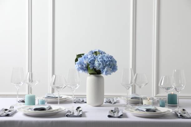 Beautiful table setting with floral decor indoors
