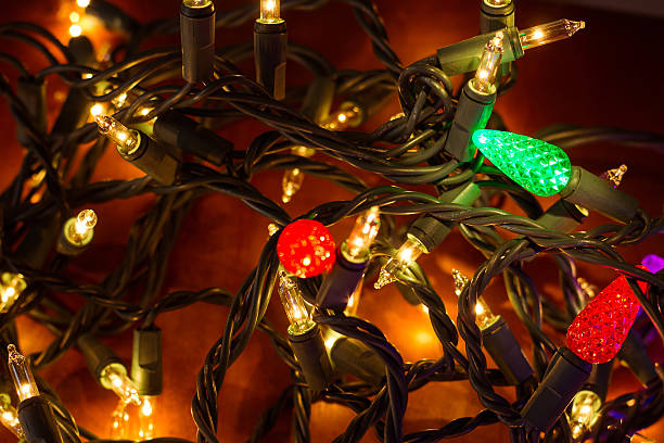 istock Christmas lights on wood 185551042