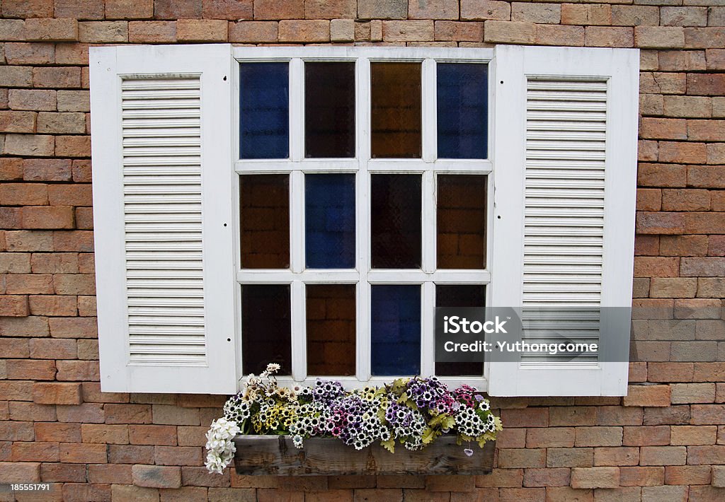 Windows on brick wall Old windows have been refurbished with a new look classic. Art Stock Photo