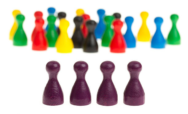istock Four purple pawns 185551820