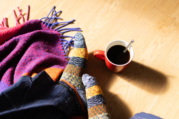 istock blanket and wool socks in winter.coffee time in winter 1855520326