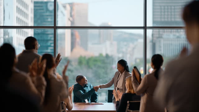 Business people, celebration and handshake for contract success, b2b deal and agreement, signature or promotion in meeting. African manager and employees shaking hands for thank you and negotiation