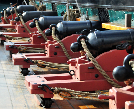 Boston, Massachusetts, USA: Charlestown Navy Yard - row of cannons - deck of the USS Constitution - Old Ironsides - photo by M.Torres