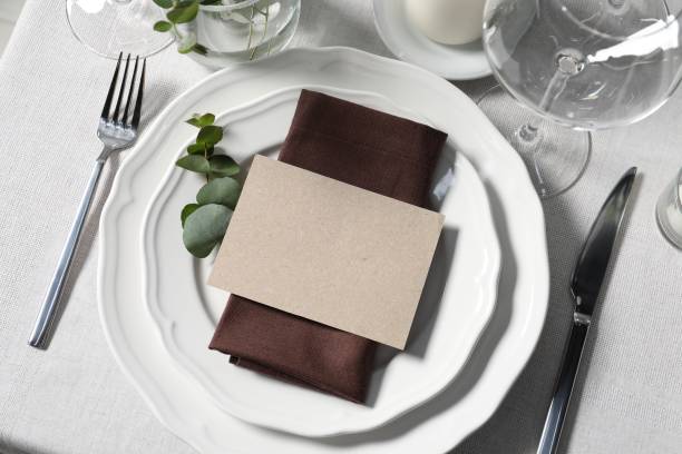 istock Beautiful table setting with blank card and floral decor, flat lay 1855561288