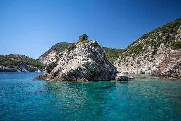istock Layered Rocks and clear Sea 185556631