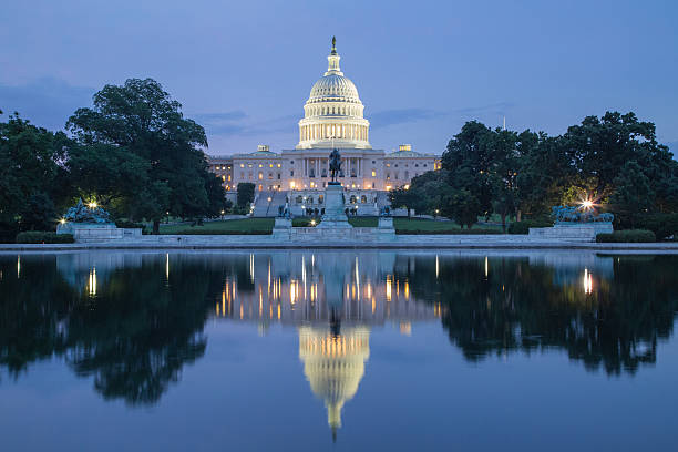 istock Reflection of US Capital Building at twilight 185556750