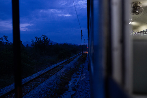 Evening sets in on the Southern Line heading towards Prachuap Khiri Khan. Rail transportation is a popular way to get around in Thailand