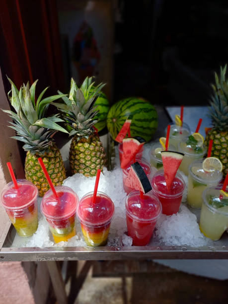 istock Various fruit smoothies in glasses with straws in a shop window for refreshment 1855589679